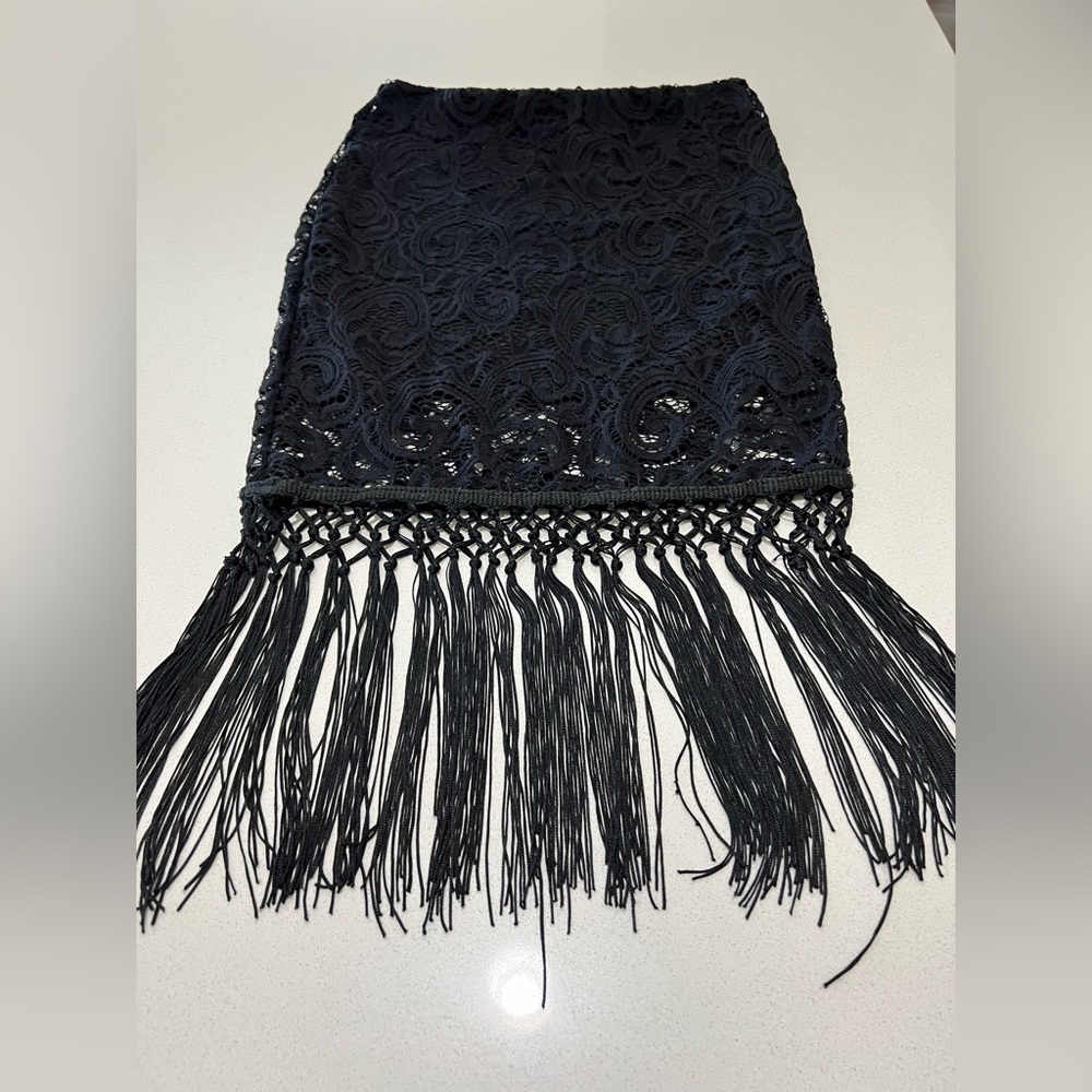 Woman all black fancy skirt.